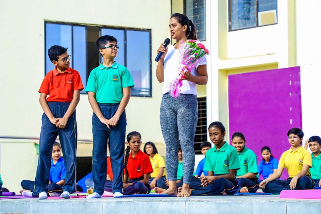 Urmi Pandya addressing her yoga students 