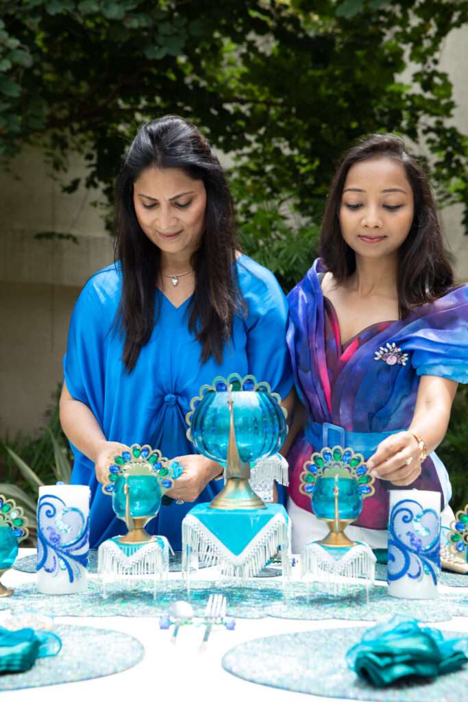 Mom-daughter duo setting up a beautiful table . Story by The Winged Women