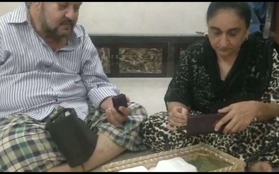 Sajda's parents opening gifts bought from her first earning of her skincare brand 