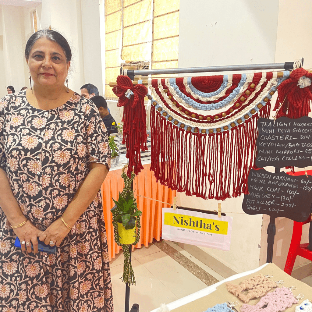 Nishtha posing with a beautiful macrame art home decor piece. The 54-year-old is running a successful crochet business