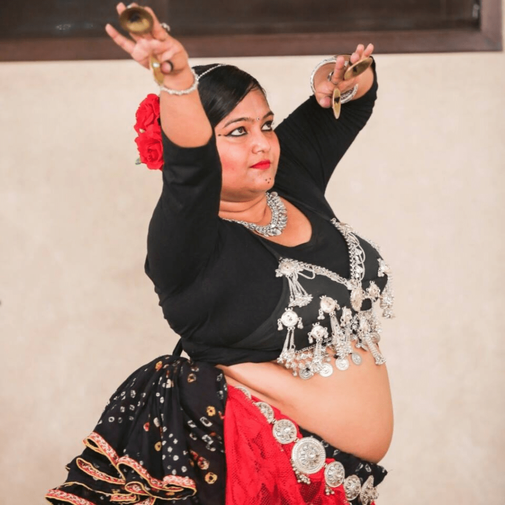 Belly dancer Preeti enjoying dance performance. Story by The Winged Women